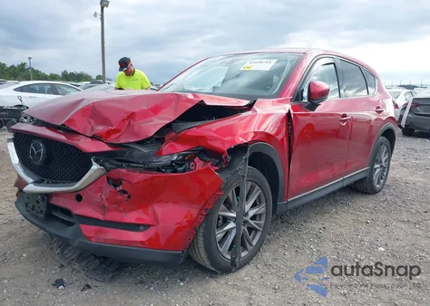 2021 Mazda Cx-5 Grand Touring z USA, uszkodzony, nr VIN JM3KFBDM7M0357057